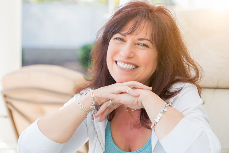 patient-smiling-after-dental implants procedure