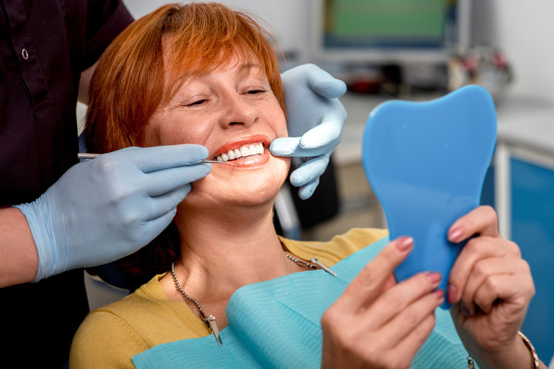 Dental Patient Getting Her Full Arch Dental Implant Procedure Finished