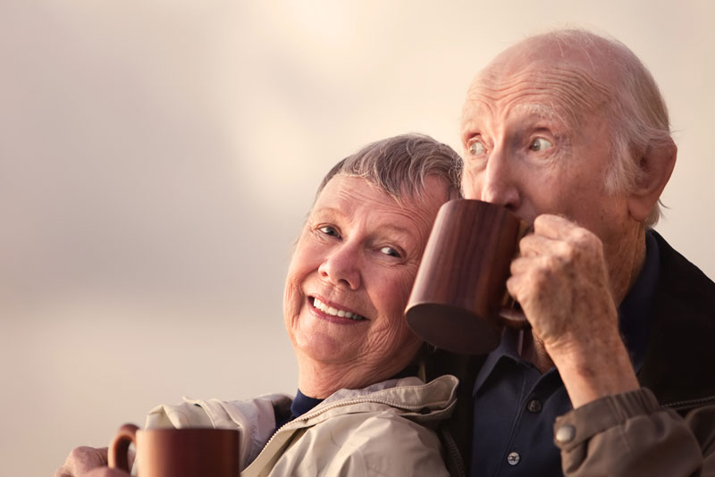 Dental Implant Patients Smiling While Drinking Coffee