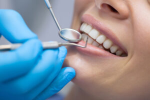 An image of a woman getting treated for gum disease.